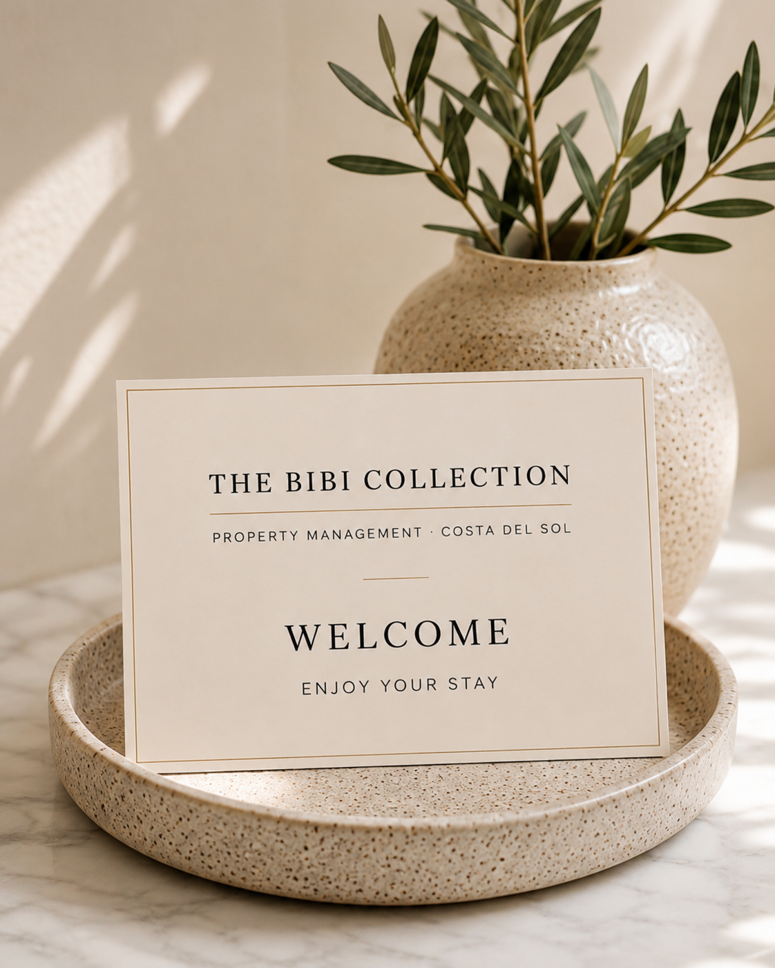 A Bibi Collection welcome card in a ceramic bowl